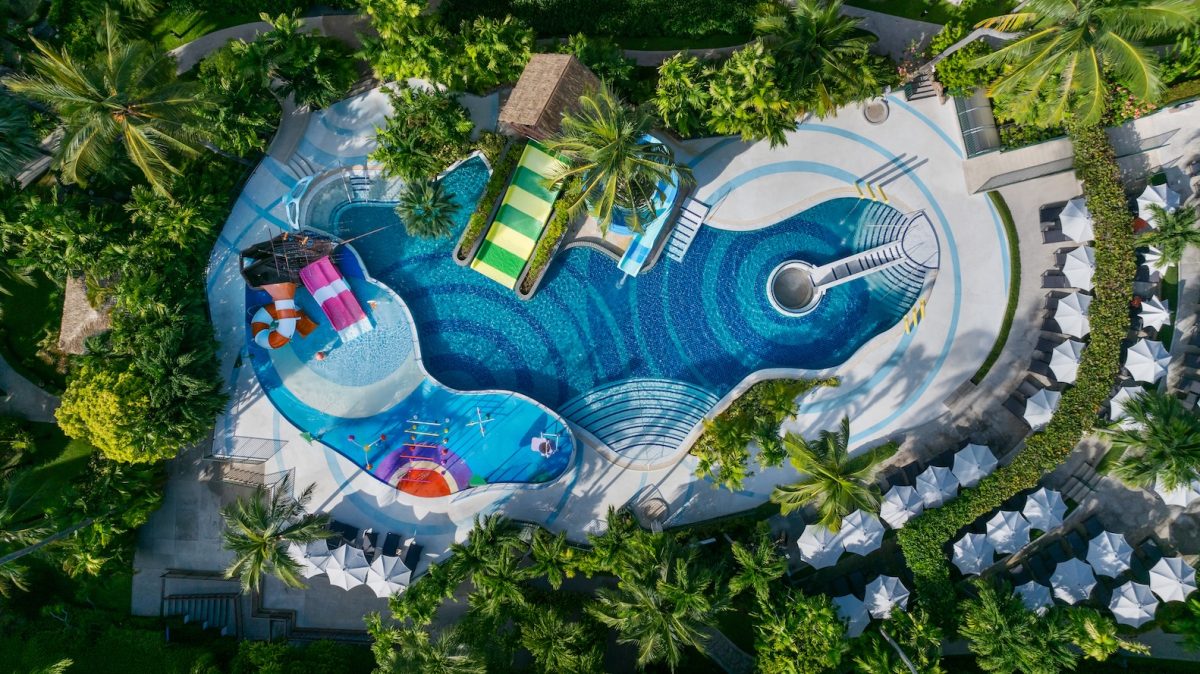 aerial view of a tropical resort's swimming pool