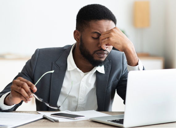 Tired-looking man at a computer