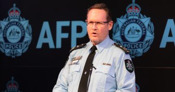 Alleged spy for Chinese government accused of infiltrating Canberra Buddhist group