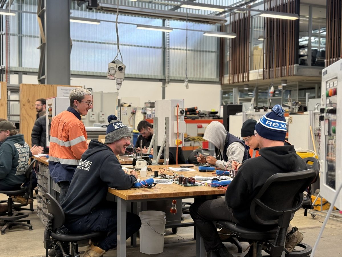 TAFE students working at a table