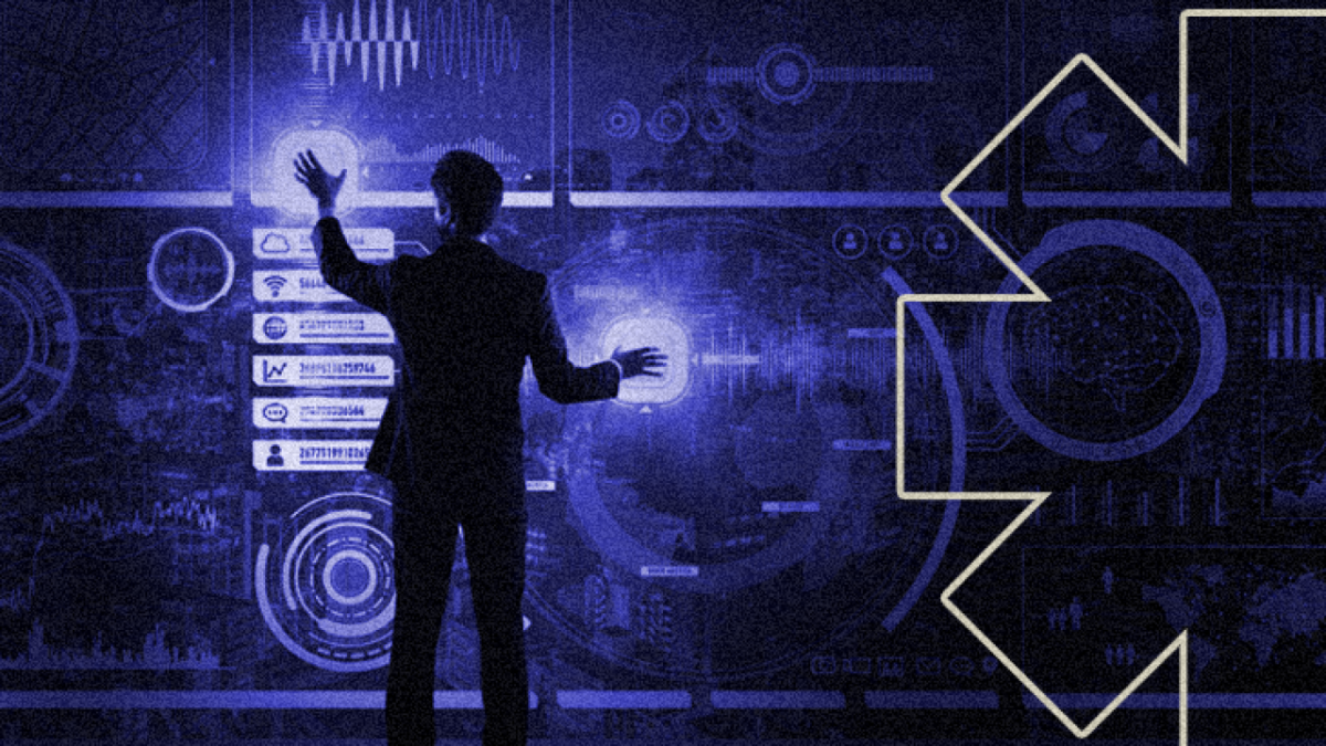 Man working a screen full of data