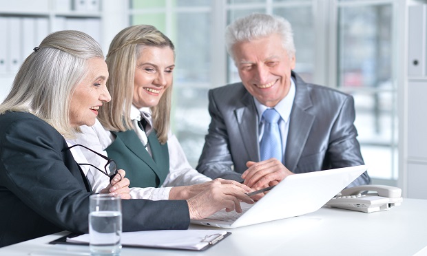 Businesspeople using a laptop
