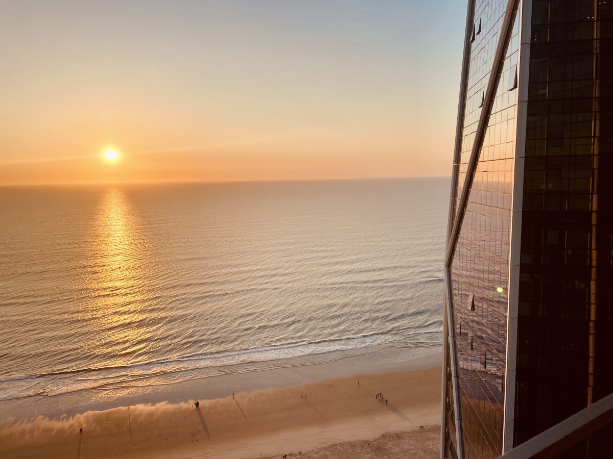 sunrise over the ocean, as viewed from a tall building