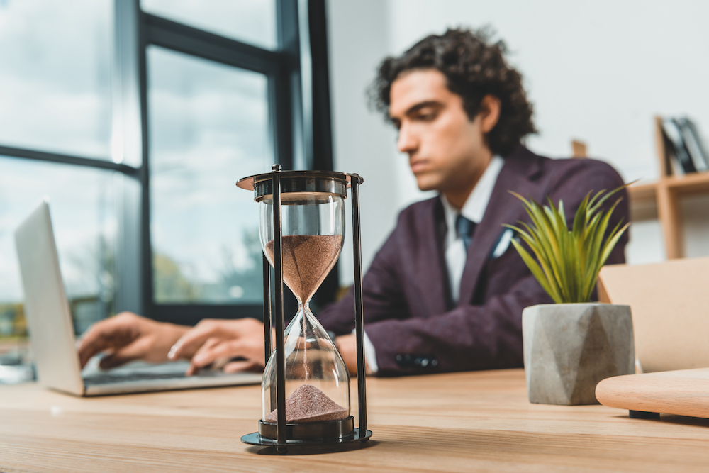 Man working with hourglass