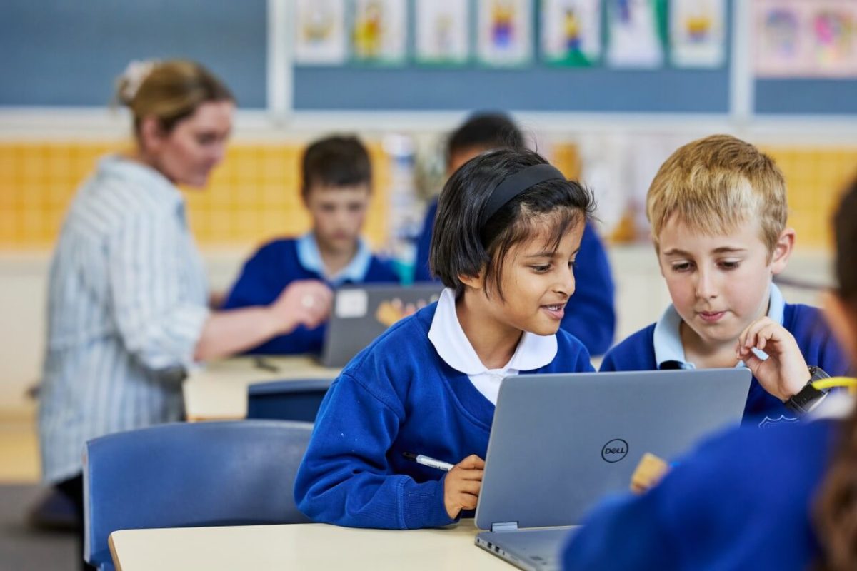 teacher with pupils in a classroom