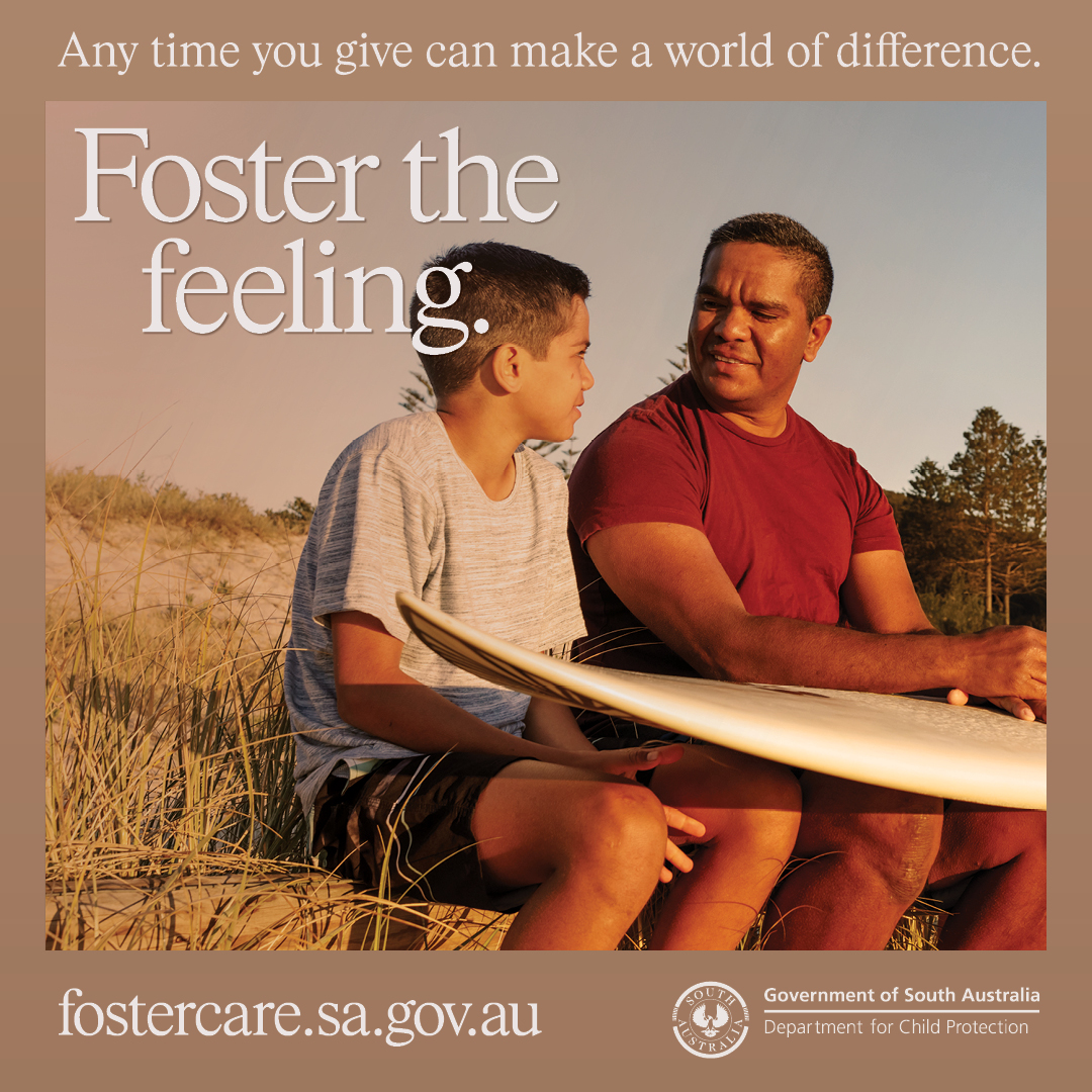 poster of a man and a boy sitting at a beach with a surfboard