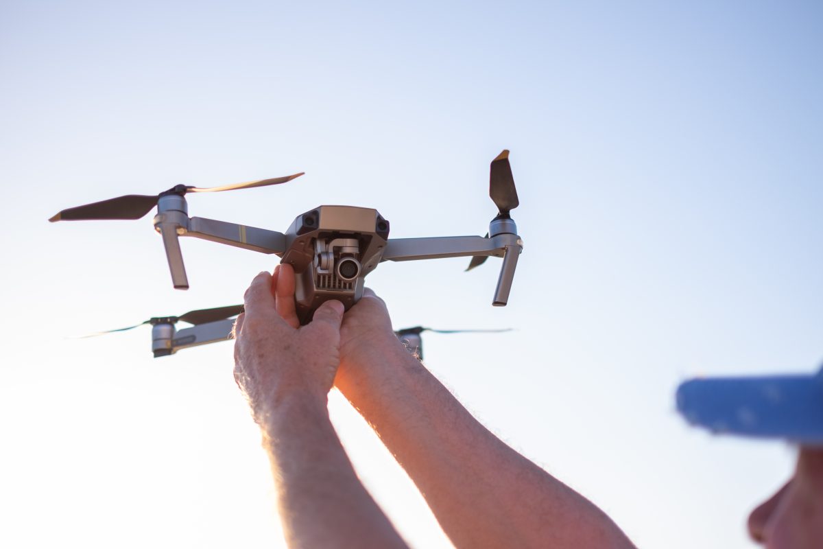 person holding a drone