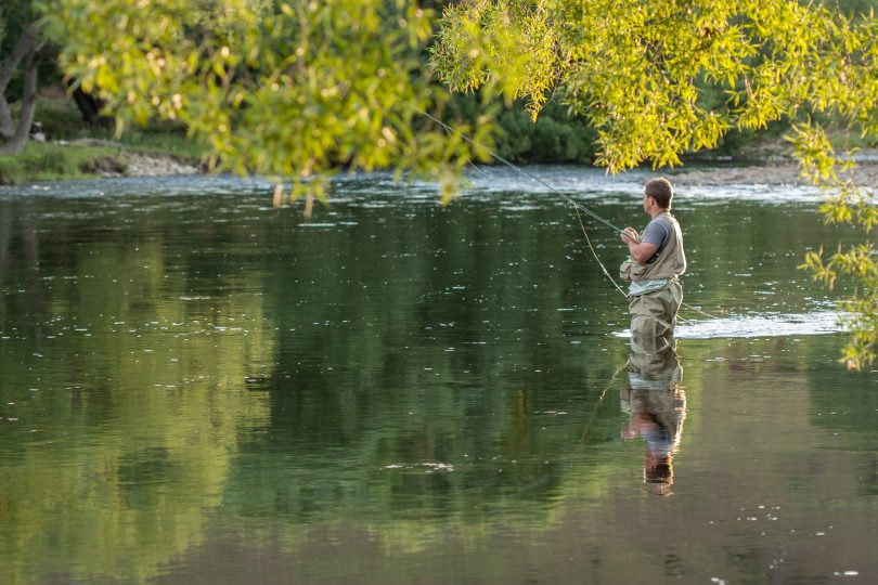 man fishing for trout