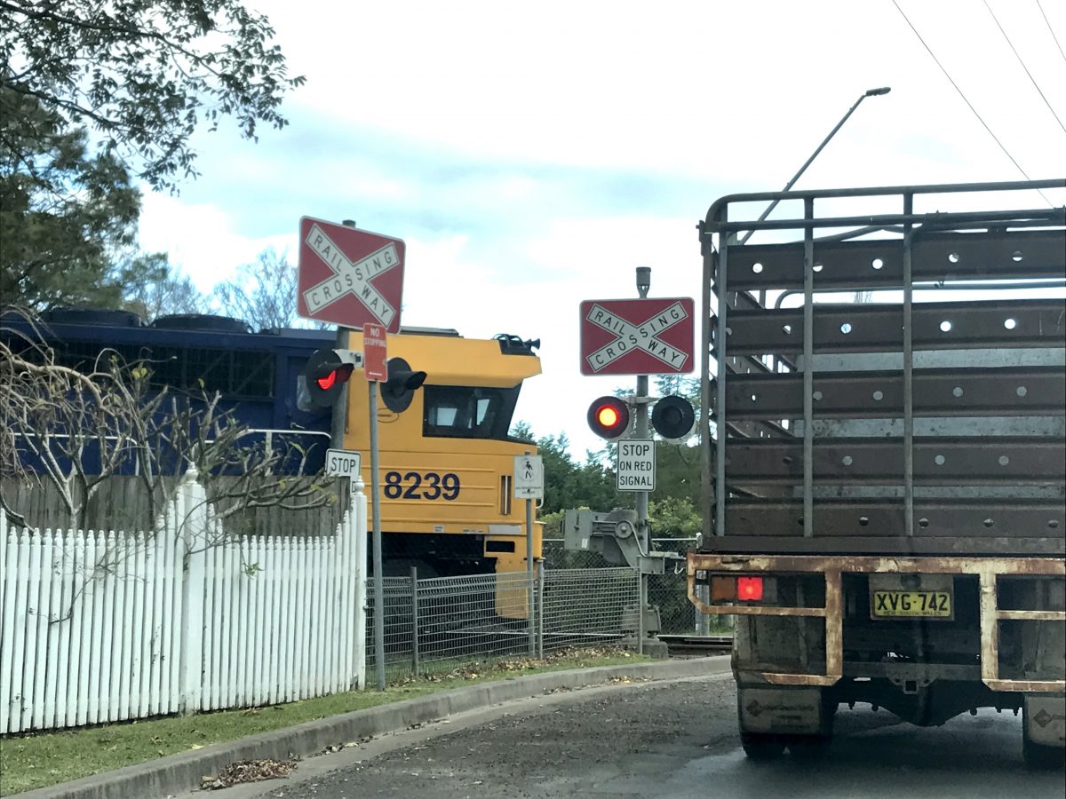 truck stopped at railway crossing
