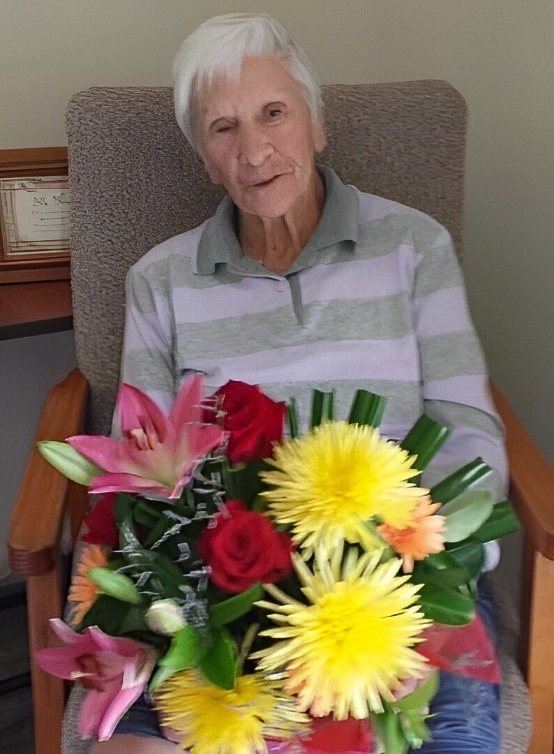 elderly woman with flowers