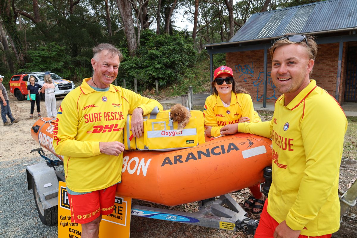 Durras resident and Batemans Bay Surf Life Saving Club member Geoff Perrem with duty officer Anthony Bellette and surf club president Kate Hunt.