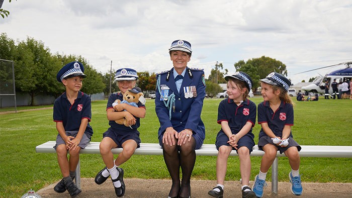 Karen Webb with Boorowa Central School students Digby Merriman, 7, Harper Maine, 7, Josie Munns, 6, and Grace Crawford, 7, following her investiture ceremony in February 2022.