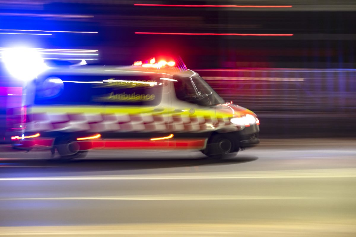 Ambulance being driven with lights flashing