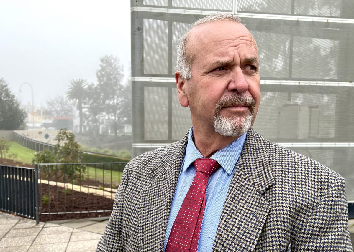 man in a suit standing outside