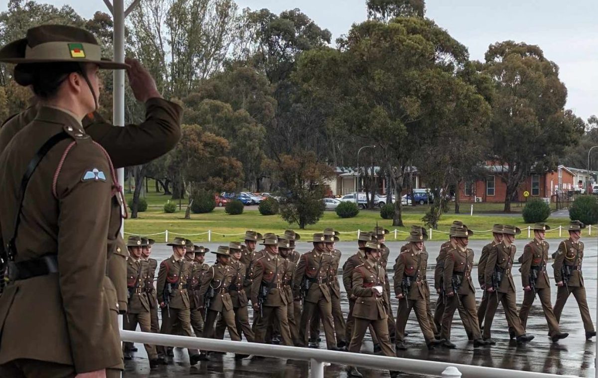 Graduating soldiers march past Kapooka Commanding Officer Colonel Tim Stone.