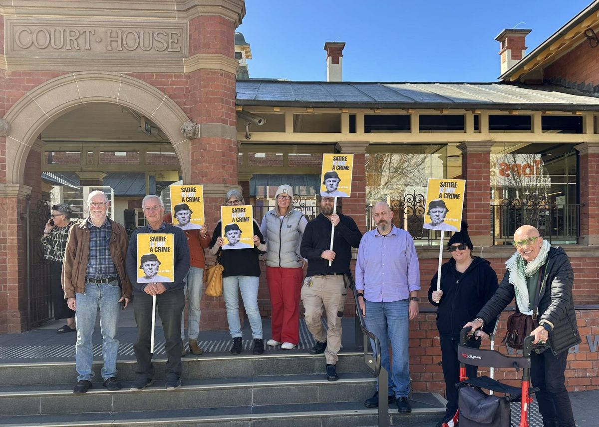 Several Wagga residents protested digital artist Michael Agzarian's recent charge of displaying Nazi symbols in a public act without lawful excuse.